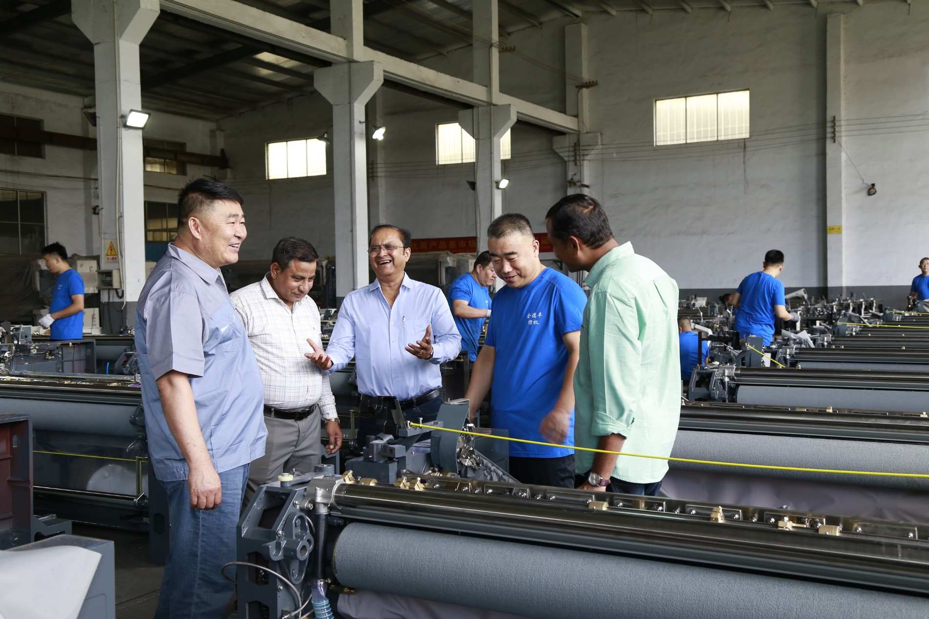 Harmony Impex checking machine parts quality with a customer