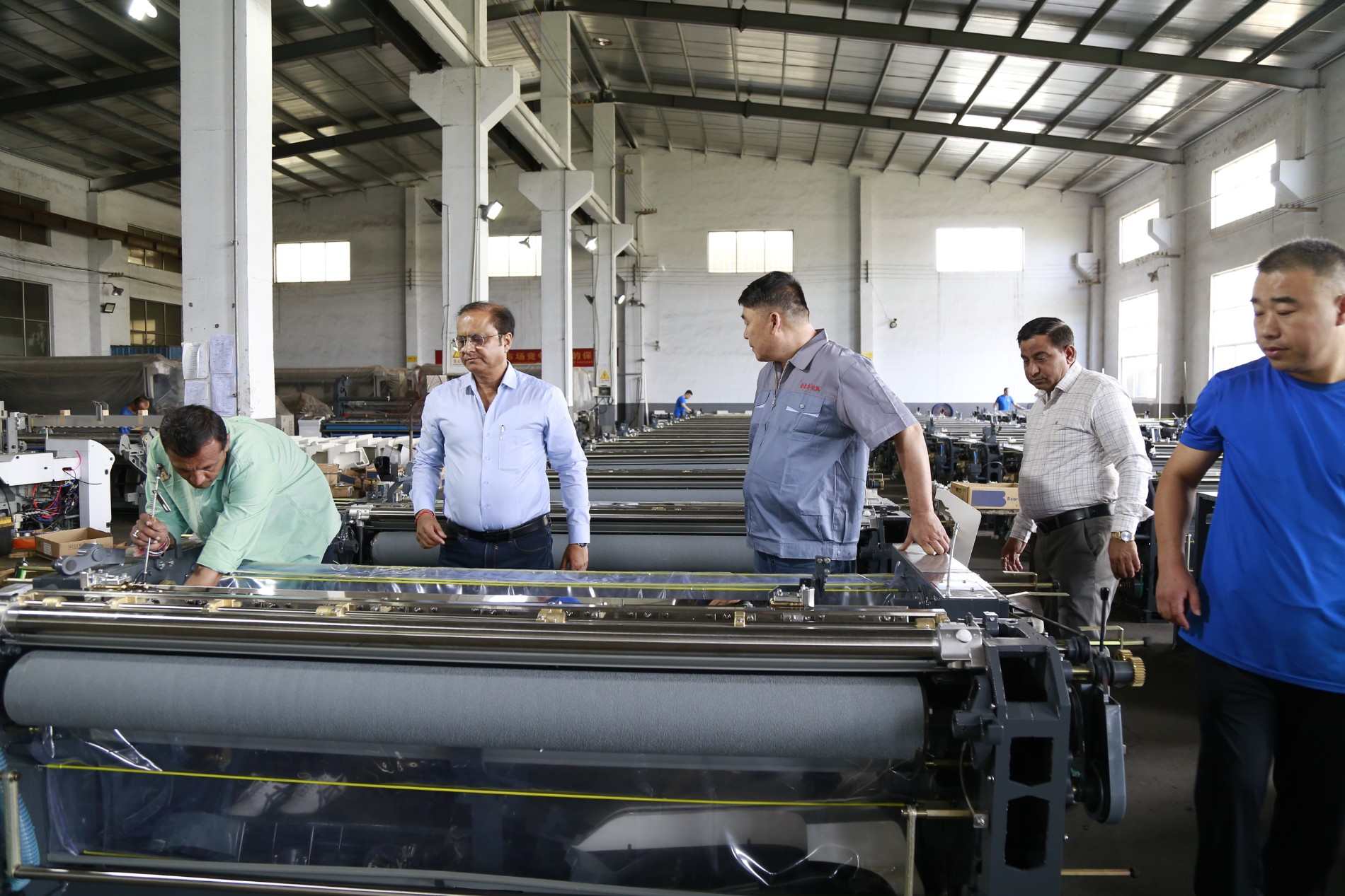 Harmony Impex China Tour 2026 - Inspection at the Assembly Area. Inspecting machinery with a customer in the assembly area.